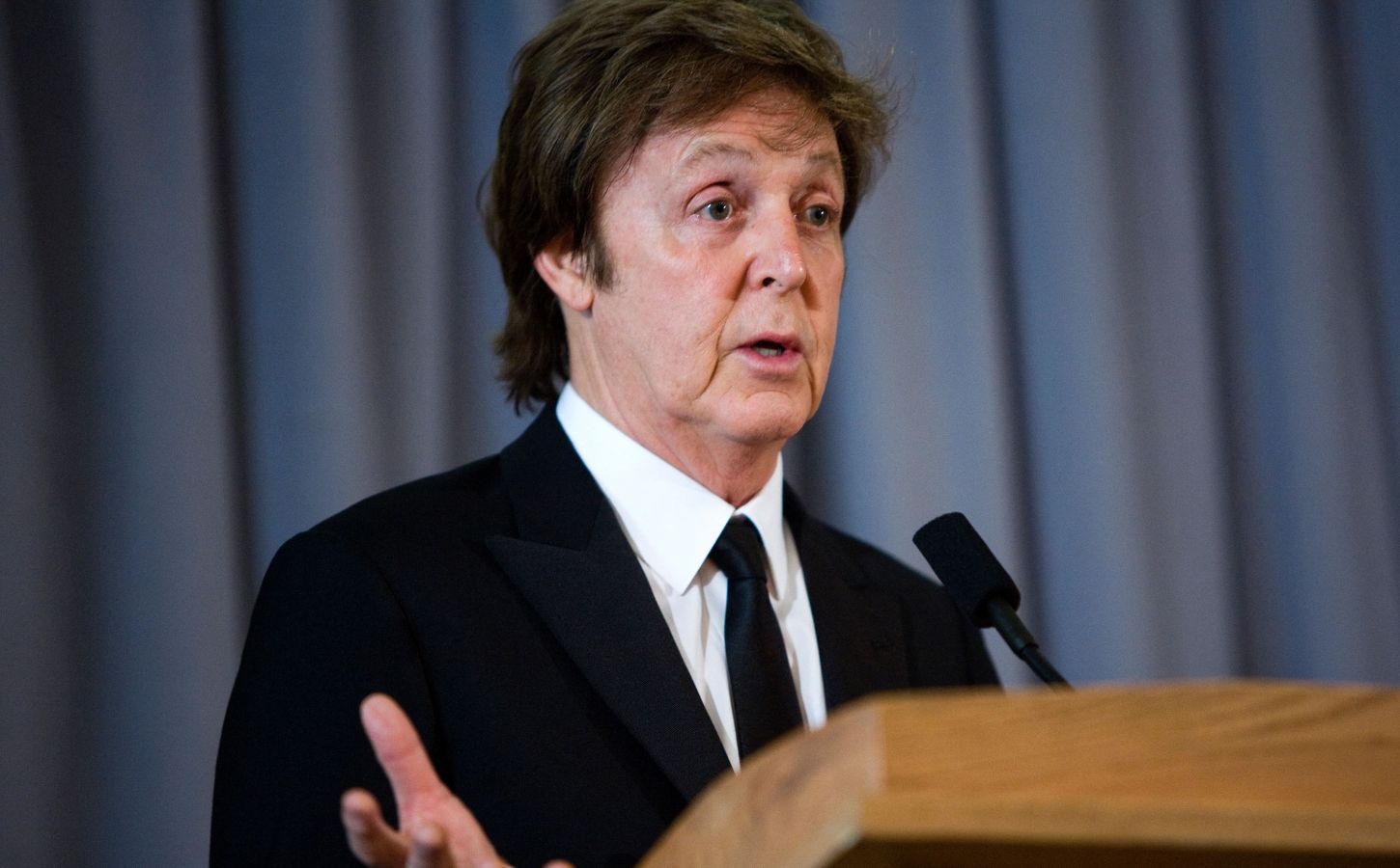 Photo shows Paul McCartney speaking at a podium. Paul McCartney and his family have called for the EU to reconsider its proposed ban on the use of ‘meaty’ words on plant-based food labels