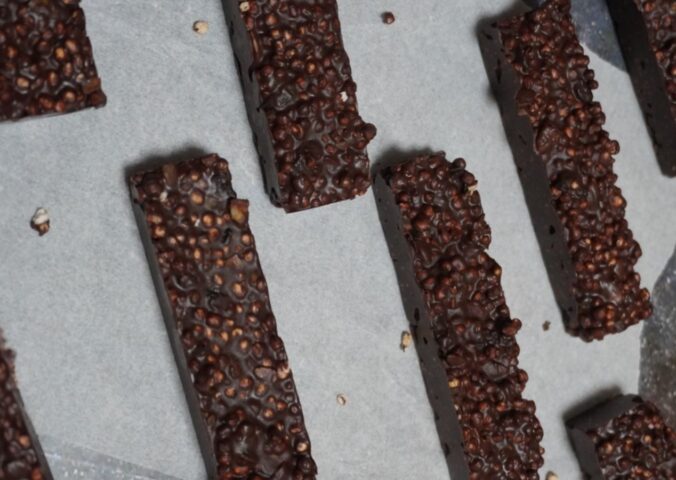 pop quinoa chocolate bars with cranberries, pop quinoa, pumpkin seeds, and peanut butter