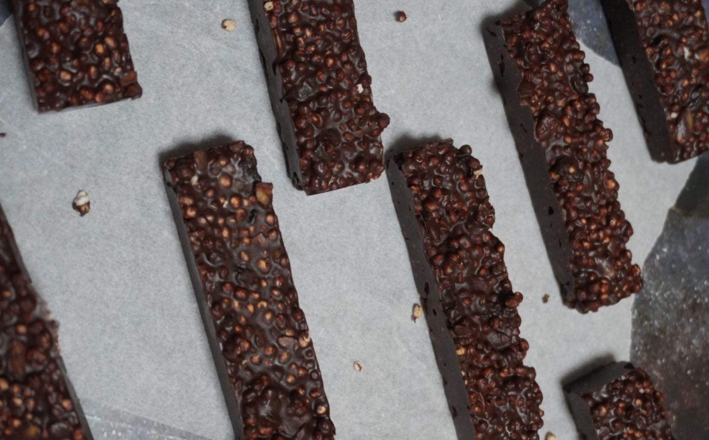 pop quinoa chocolate bars with cranberries, pop quinoa, pumpkin seeds, and peanut butter