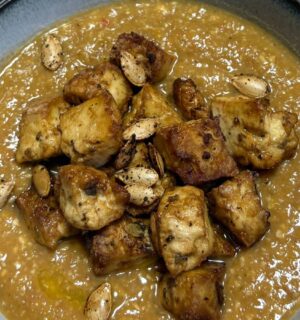 pumpkin and green lentil soup with pumpkin seeds and toasted bread