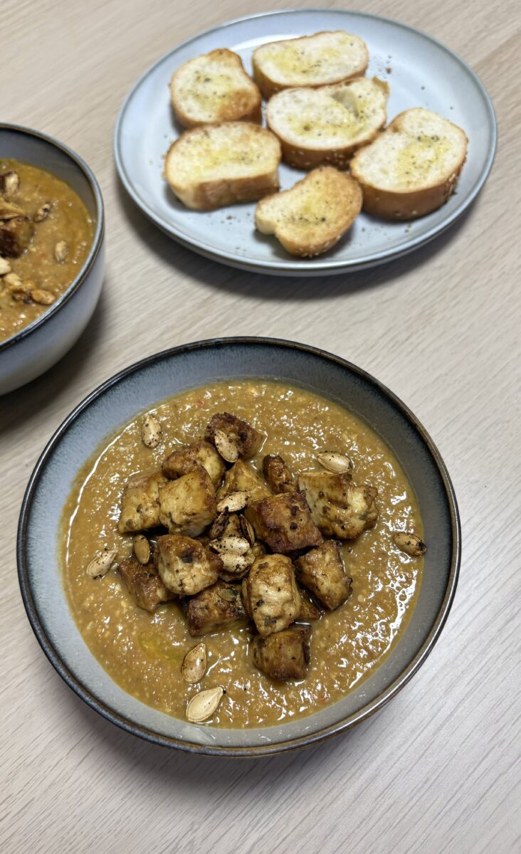 pumpkin and green lentil soup with pumpkin seeds and toasted bread