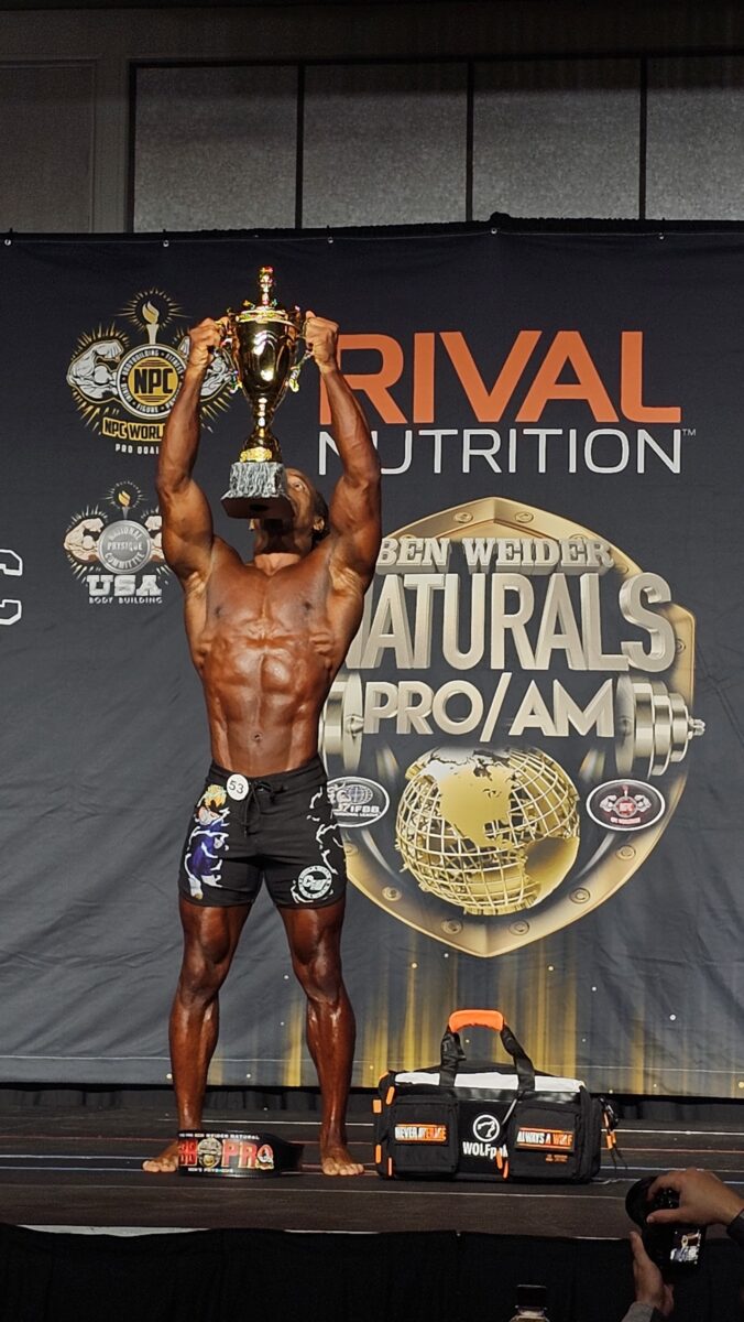 Photo shows vegan athlete Torre Washington at the 2025 Ben Weider Naturals Pro in November, where he took first place in two different classes, the Open Masters and Masters 40, thereby qualifying for Mr Olympia 2026 next September