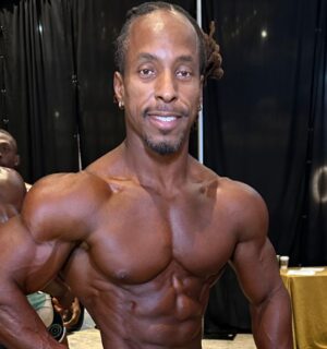 Photo shows vegan athlete Torre Washington at the 2025 Ben Weider Naturals Pro in November, where he took first place in two different classes, the Open Masters and Masters 40, thereby qualifying for Mr Olympia 2026 next September