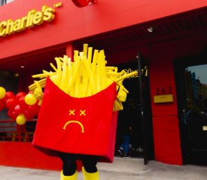 Photo shows a Mr Charlie's French fries mascot posing outside a recently opened branch of the "vegan McDonald's" in Los Angeles, California