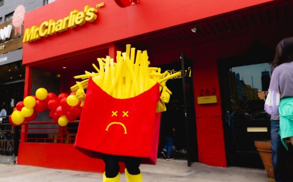 Photo shows a Mr Charlie's French fries mascot posing outside a recently opened branch of the "vegan McDonald's" in Los Angeles, California