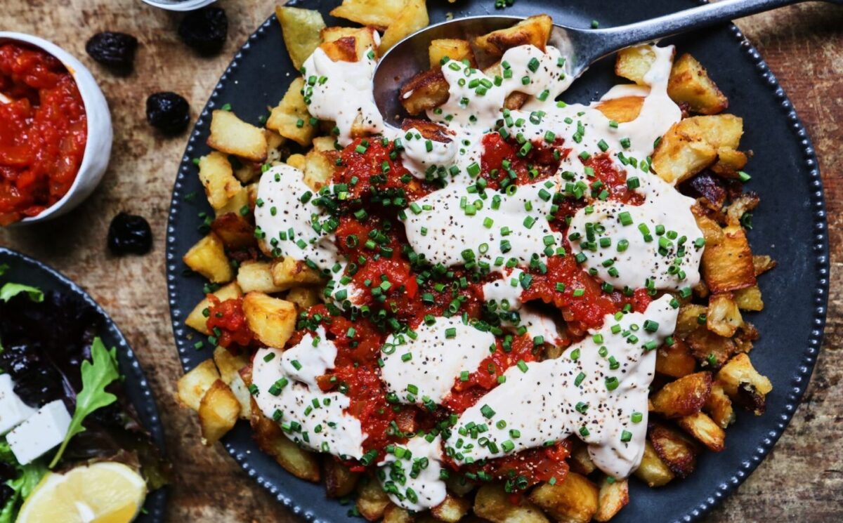 patatas bravas with vegan mayo, chili, tomato, and garlic for after NYE