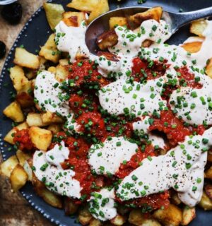 patatas bravas with vegan mayo, chili, tomato, and garlic for after NYE