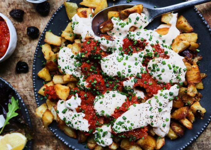 patatas bravas with vegan mayo, chili, tomato, and garlic for after NYE