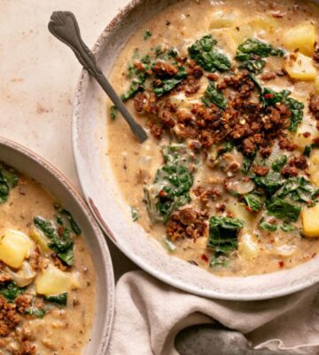 vegan zuppa Toscana soup with potatoes, kale, nutritional yeast, and vegan beef