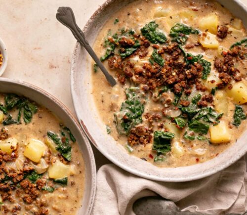 vegan zuppa Toscana soup with potatoes, kale, nutritional yeast, and vegan beef