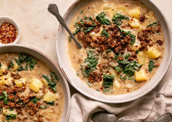 vegan zuppa Toscana soup with potatoes, kale, nutritional yeast, and vegan beef