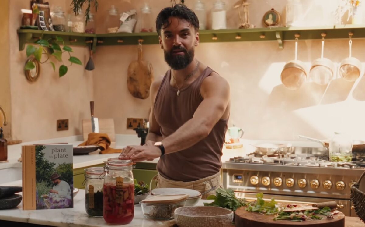 Former chef Gaz Oakley stands behind the kitchen counter of his off-grid home in rural Wales