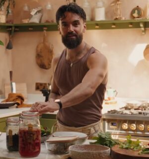 Former chef Gaz Oakley stands behind the kitchen counter of his off-grid home in rural Wales