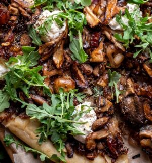 a caramelized shallot and wild mushroom pizza with dates and arugula for weeknight vegan dinners