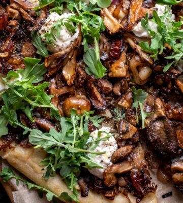 a caramelized shallot and wild mushroom pizza with dates and arugula for weeknight vegan dinners