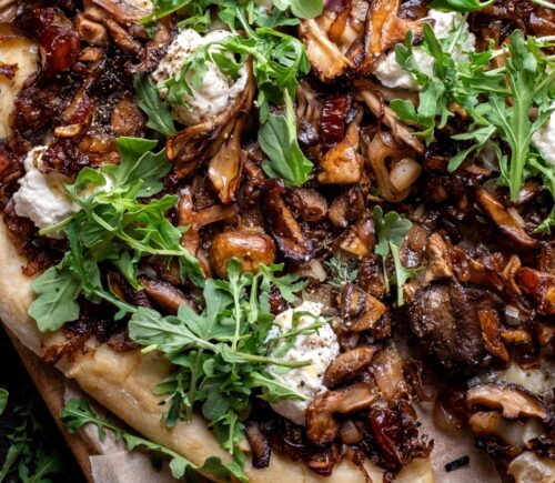 a caramelized shallot and wild mushroom pizza with dates and arugula for weeknight vegan dinners