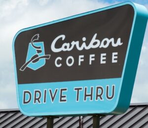 Photo shows the sign of a Caribou Coffee Drive Thru store. Caribou Coffee just announced that it will be scrapping its plant-based milk surcharge going forward