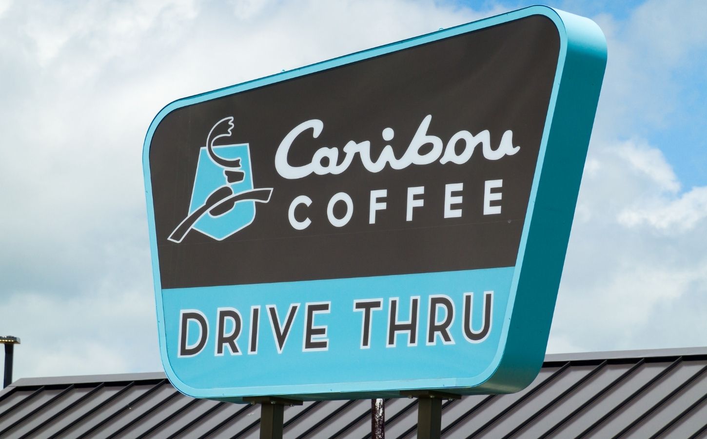 Photo shows the sign of a Caribou Coffee Drive Thru store. Caribou Coffee just announced that it will be scrapping its plant-based milk surcharge going forward