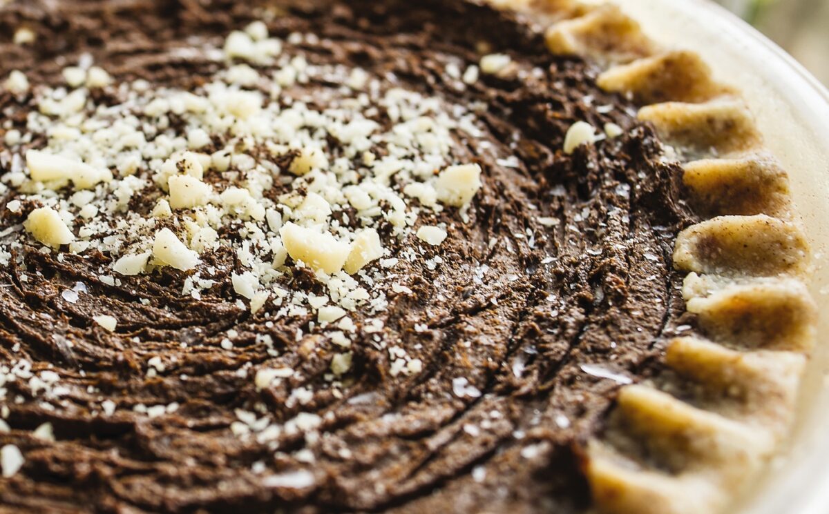 chocolate cream pie with avocado, nuts, cocoa, and dates