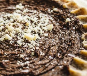 chocolate cream pie with avocado, nuts, cocoa, and dates