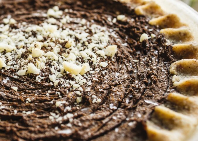 chocolate cream pie with avocado, nuts, cocoa, and dates