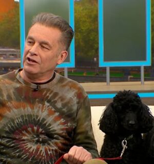 Photo shows Chris Packham, left, and his dogs Sid and Nancy, right, in a recent appearance on 'Good Morning Britain,' where Packham explained why his dogs were following a plant-based diet for Veganuary