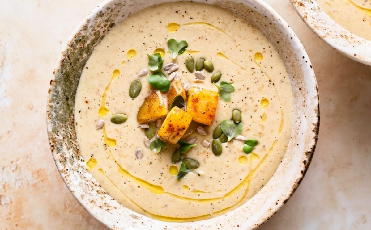 creamy roasted gold potato leek soup with coconut milk, nutritional yeast and pumpkin seeds for weeknight vegan dinners