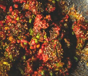 firecracker broccoli with gochujang, garlic, scallions, and soy sauce