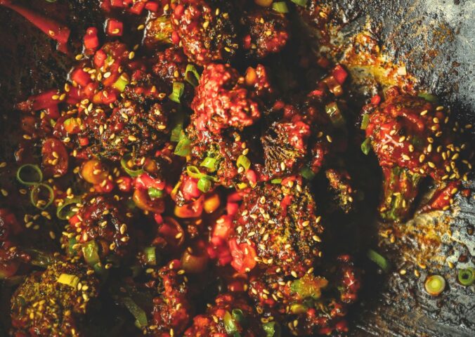 firecracker broccoli with gochujang, garlic, scallions, and soy sauce