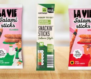 Photo shows the two new vegan Salami Stick products from La Vie, with Classic on the left and Spicy on the right, as well as a similar product from Aldi in the middle, the classic flavored "Snackin' Stick"