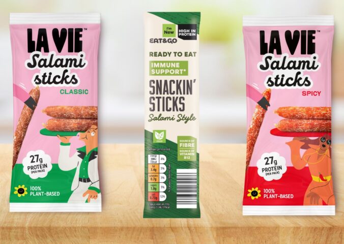 Photo shows the two new vegan Salami Stick products from La Vie, with Classic on the left and Spicy on the right, as well as a similar product from Aldi in the middle, the classic flavored "Snackin' Stick"