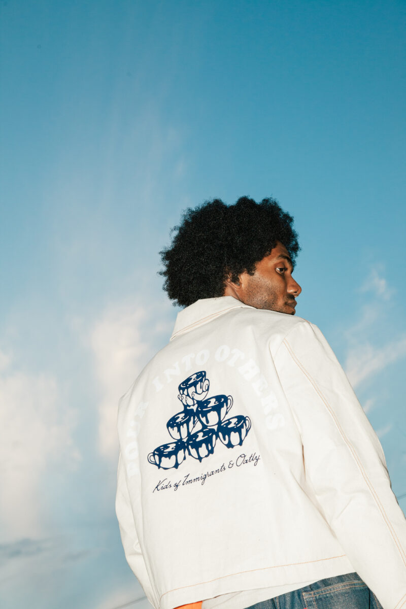 Oatly and Kids of Immigrants (KOI), an LA-based fashion brand, just launched a new limited-edition workwear capsule inspired by baristas