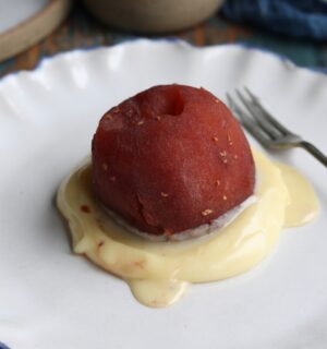 vegan raspberry poached apple with white chocolate sauce