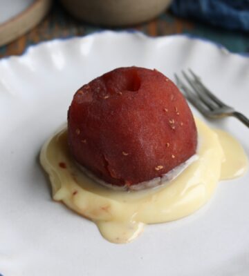 vegan raspberry poached apple with white chocolate sauce
