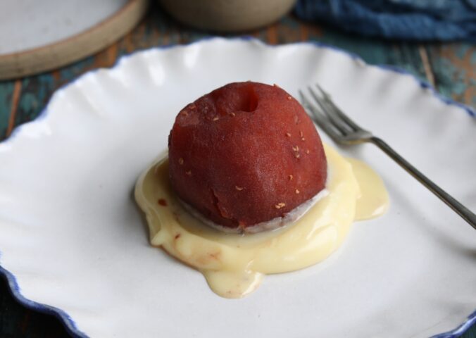 vegan raspberry poached apple with white chocolate sauce