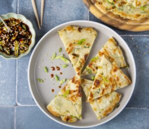 easy vegan spring onion pancakes made with maple syrup, spring onion, and sesame oil in a simple dough