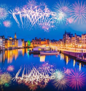 Photo shows a firework display over the iconic buildings and water of Amsterdam. The Netherlands has just banned fireworks nationwide for ordinary people, including on New Year's Eve.