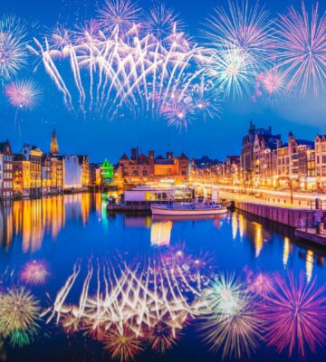 Photo shows a firework display over the iconic buildings and water of Amsterdam. The Netherlands has just banned fireworks nationwide for ordinary people, including on New Year's Eve.
