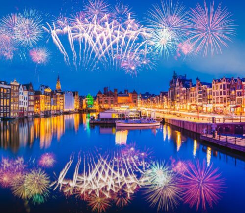 Photo shows a firework display over the iconic buildings and water of Amsterdam. The Netherlands has just banned fireworks nationwide for ordinary people, including on New Year's Eve.