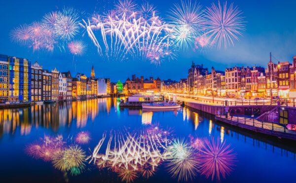 Photo shows a firework display over the iconic buildings and water of Amsterdam. The Netherlands has just banned fireworks nationwide for ordinary people, including on New Year's Eve.