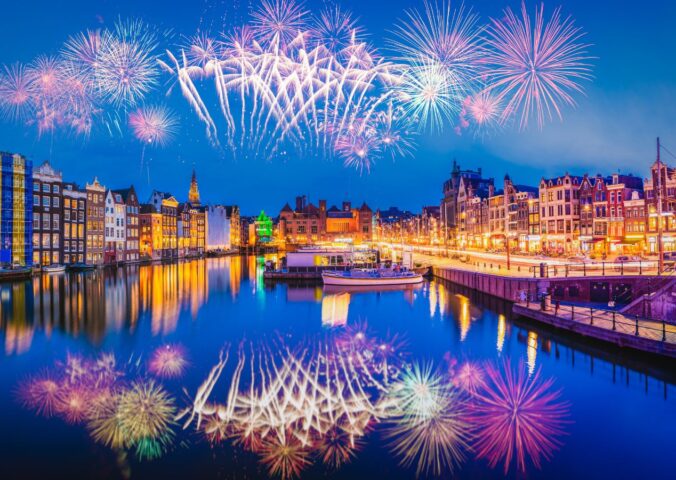 Photo shows a firework display over the iconic buildings and water of Amsterdam. The Netherlands has just banned fireworks nationwide for ordinary people, including on New Year's Eve.