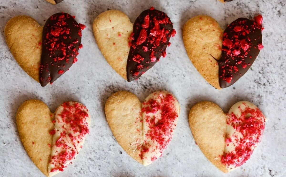 vegan chocolate dipped heart-shaped cookies for a sweet vegan Valentine's Day