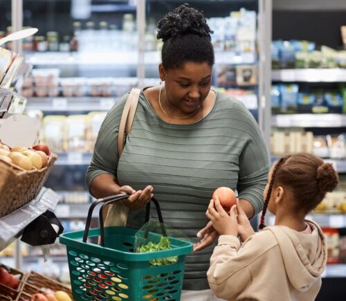 Photo shows a mother and daughter food shopping. According to Veganuary, a third of people in the UK will be shopping for plant-based foods this month