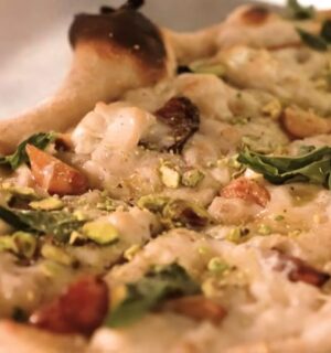 Baked pizza from Millennium restaurant topped with Miyoko's fermented vegan mozzarella that has melted and set in the oven