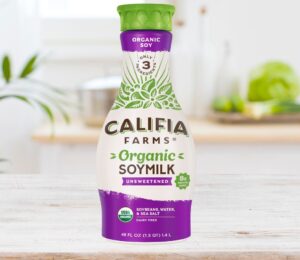 Photo shows a carton of the new Califia Farms soy milk on a wooden countertop in a kitchen