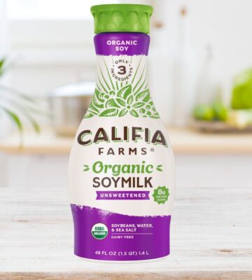 Photo shows a carton of the new Califia Farms soy milk on a wooden countertop in a kitchen