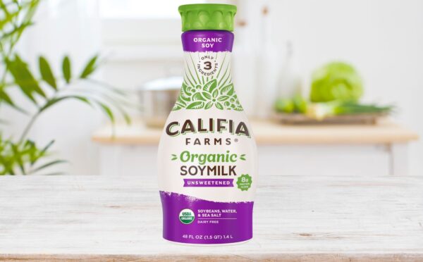 Photo shows a carton of the new Califia Farms soy milk on a wooden countertop in a kitchen