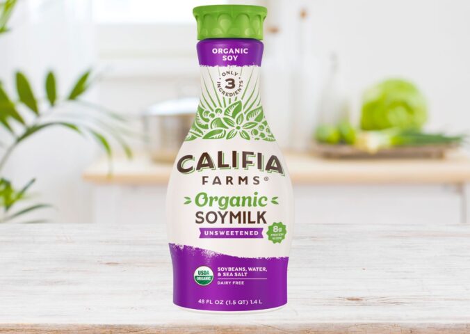 Photo shows a carton of the new Califia Farms soy milk on a wooden countertop in a kitchen