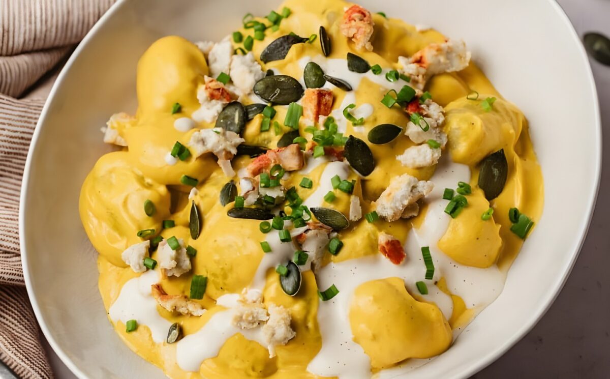 cream of pumpkin gnocchi with vegan cheese and pumpkin seeds