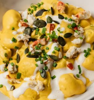 cream of pumpkin gnocchi with vegan cheese and pumpkin seeds